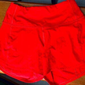 Lulu Lemon red shorts, no size tag, believe they are size 2